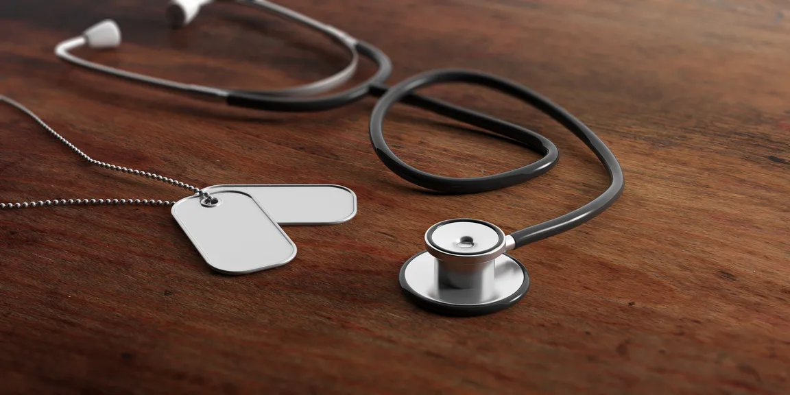 Veteran Dog Tags on Chain with Stethoscope on Wooden Table