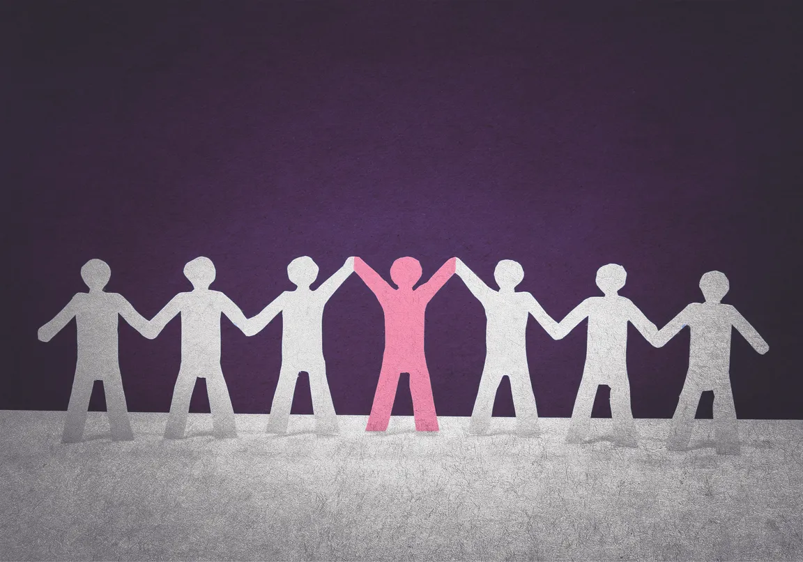 Paper cut-outs of a leader with team