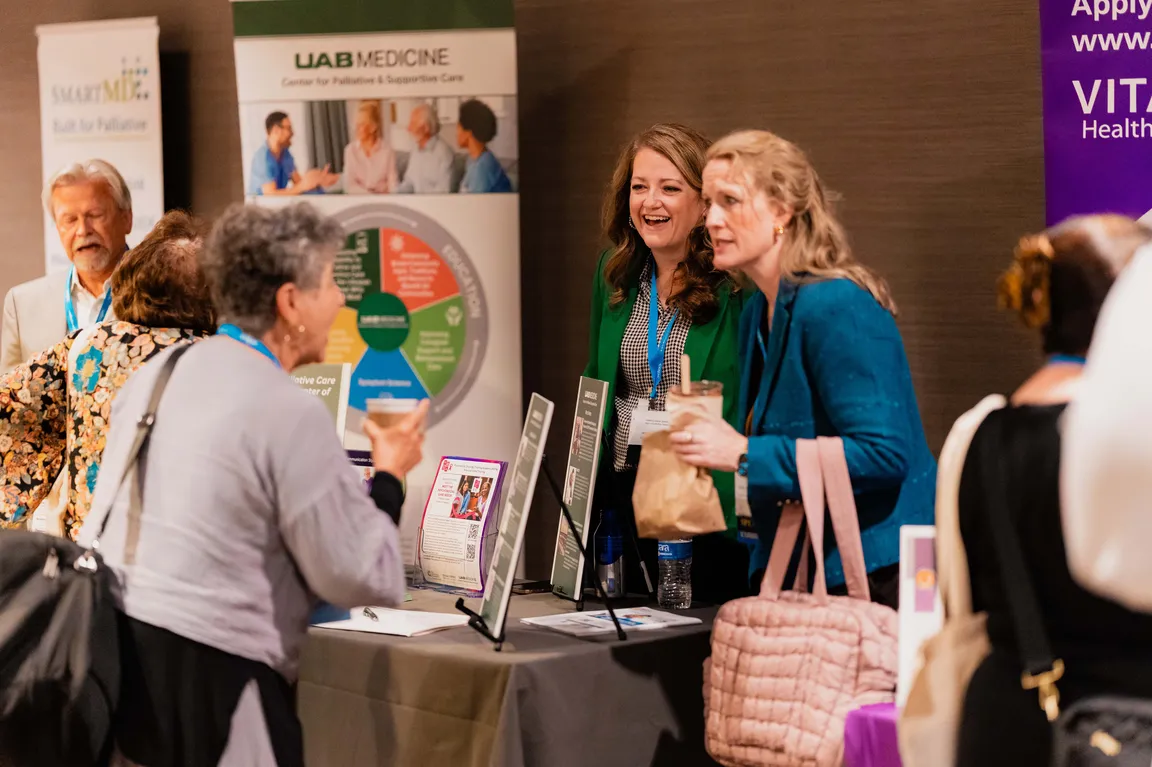 Photograph of attendees exploring the 2025 Seminar Exhibit Hall