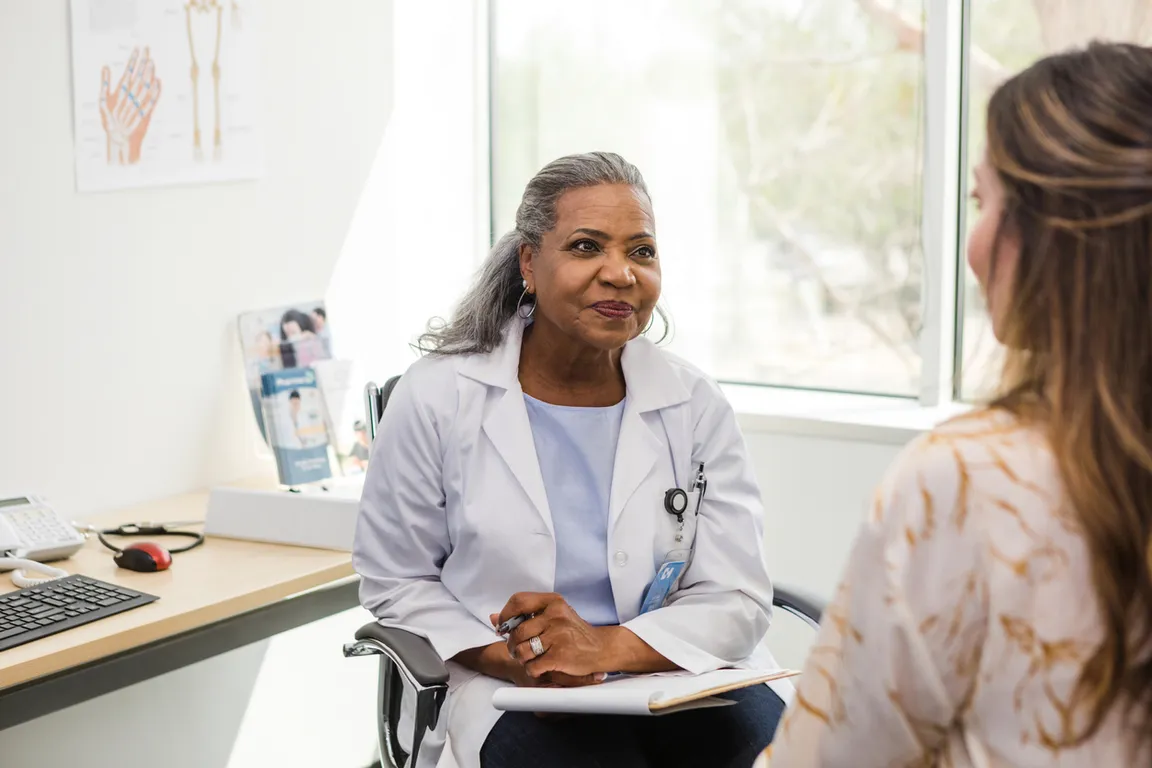 Clinician and patient sitting in an office