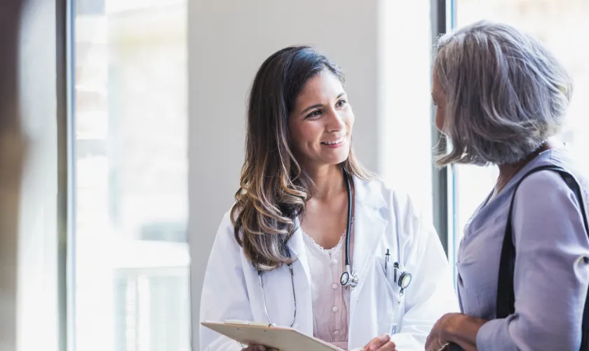 Clinician speaking with a patient and showing empathy_840x500