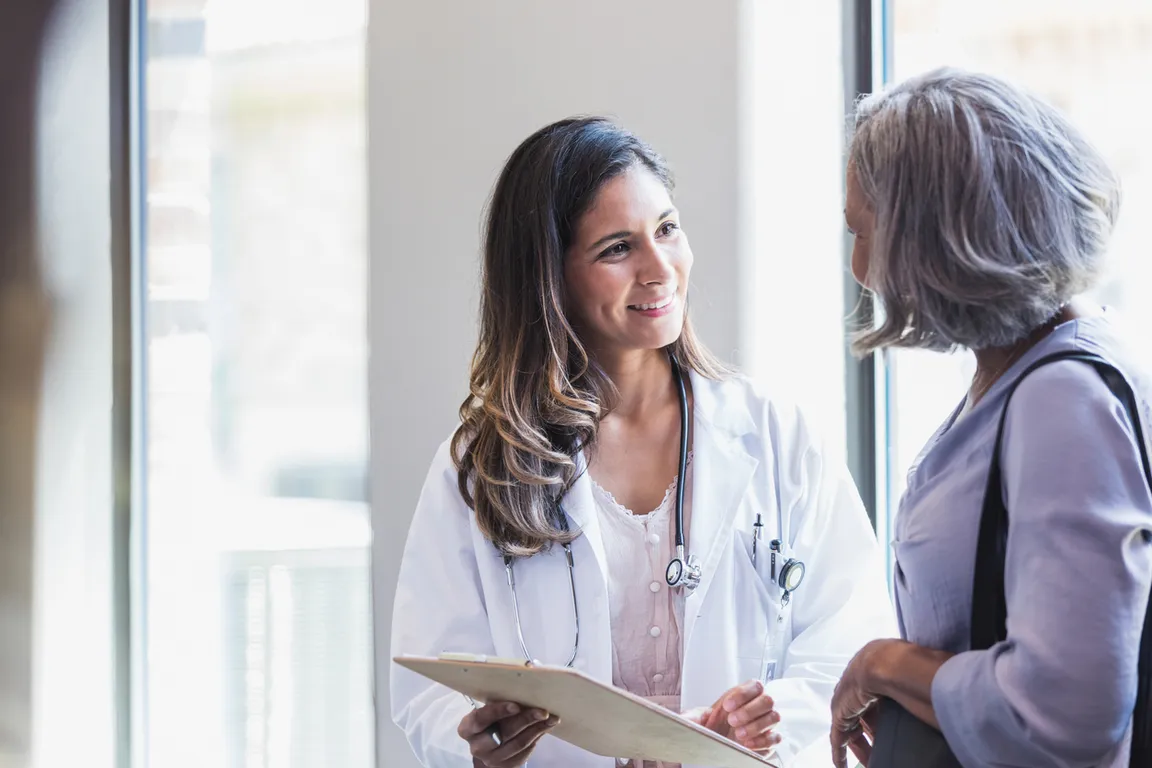 Clinician speaking with a patient and showing empathy