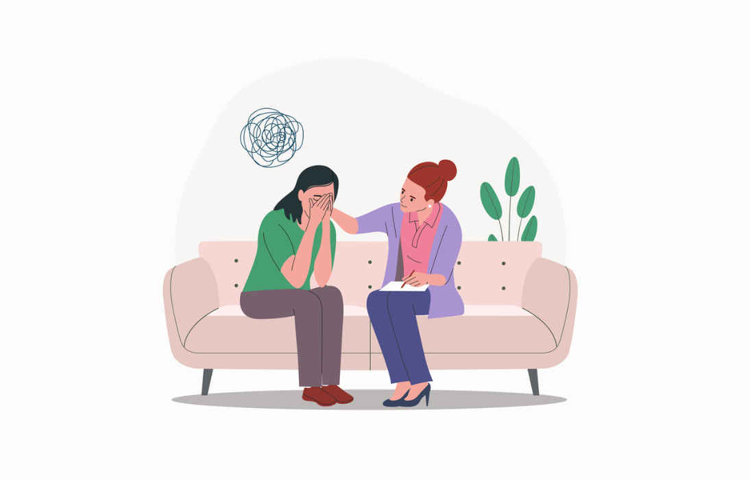 Clinician talking to a patient sitting on couch-living loss_1094x700