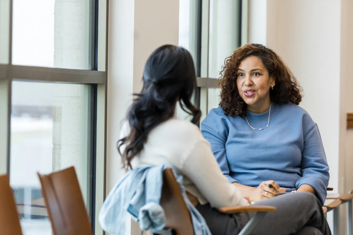 Community health worker talking to a patient