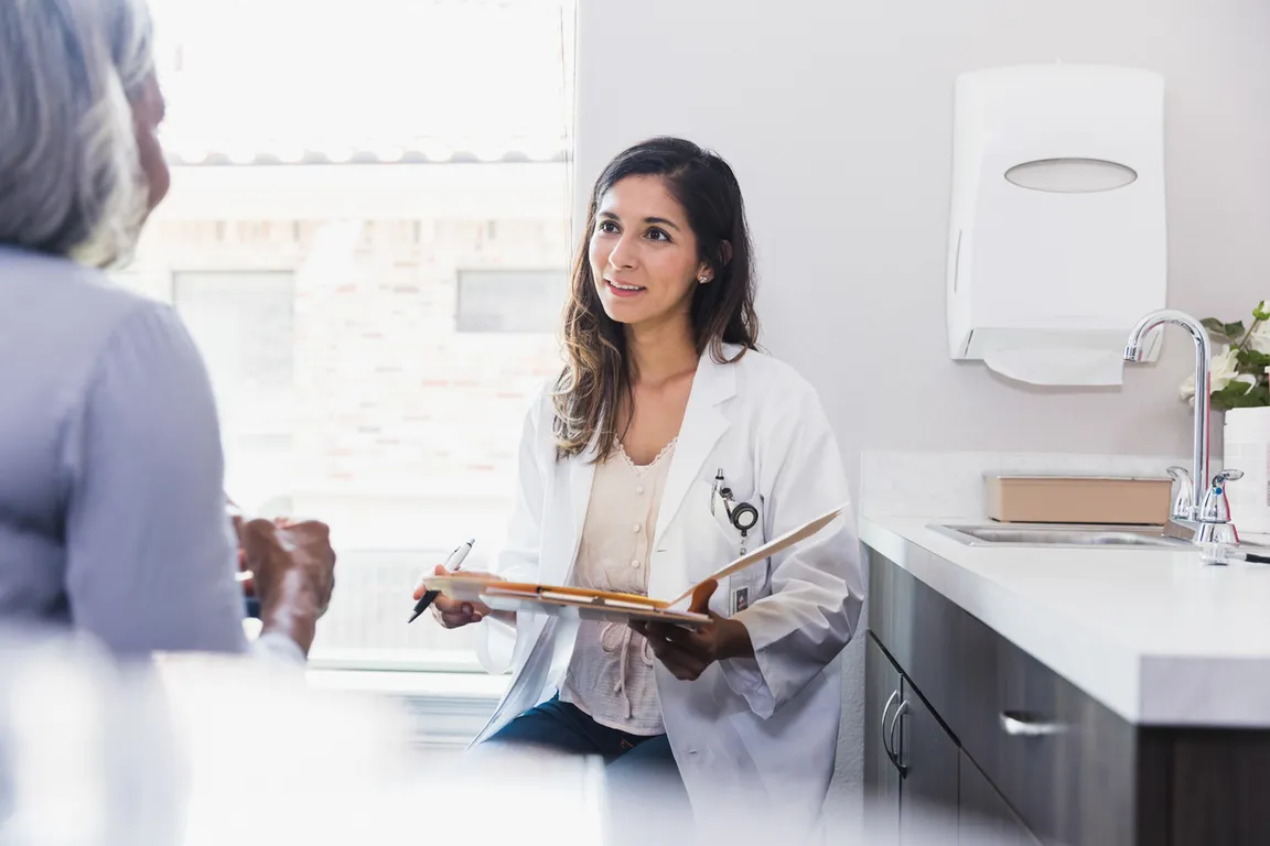 Female doctor meets with a patient in a clinic or hospital setting