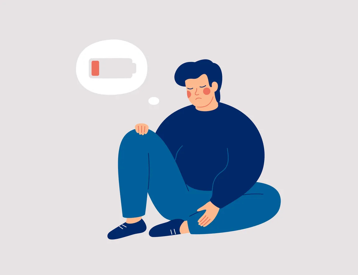 Graphic image of a person sitting on the floor experiencing fatigue
