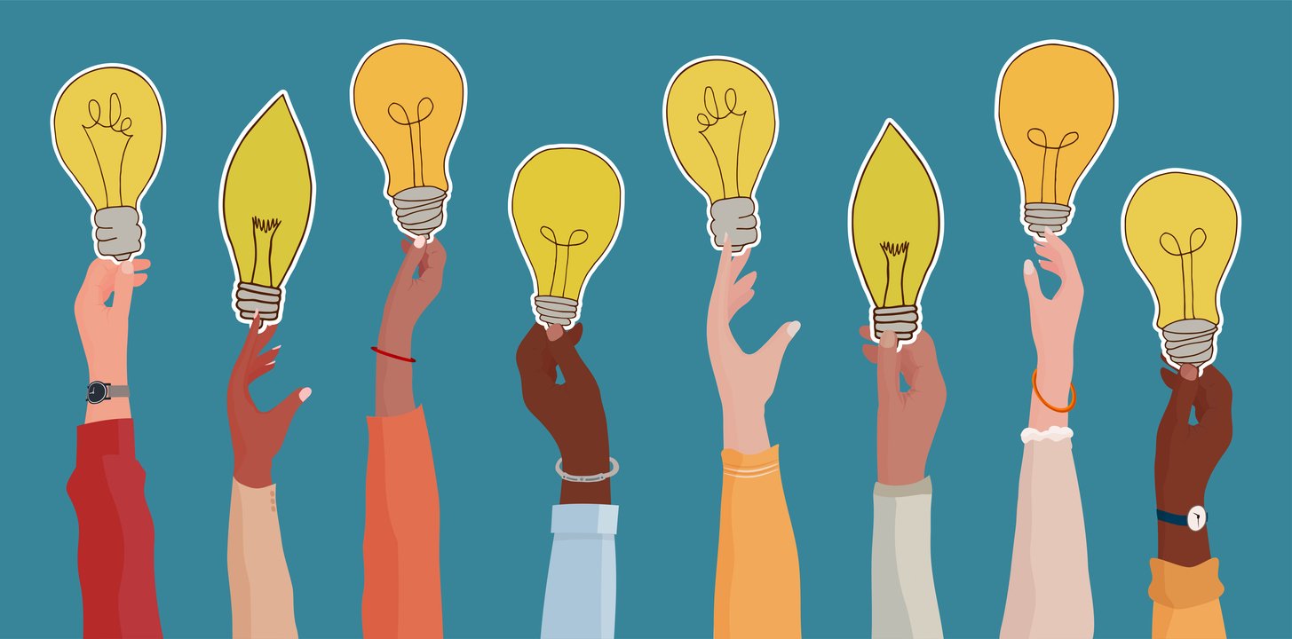 Hands holding up lightbulbs to represent ideas