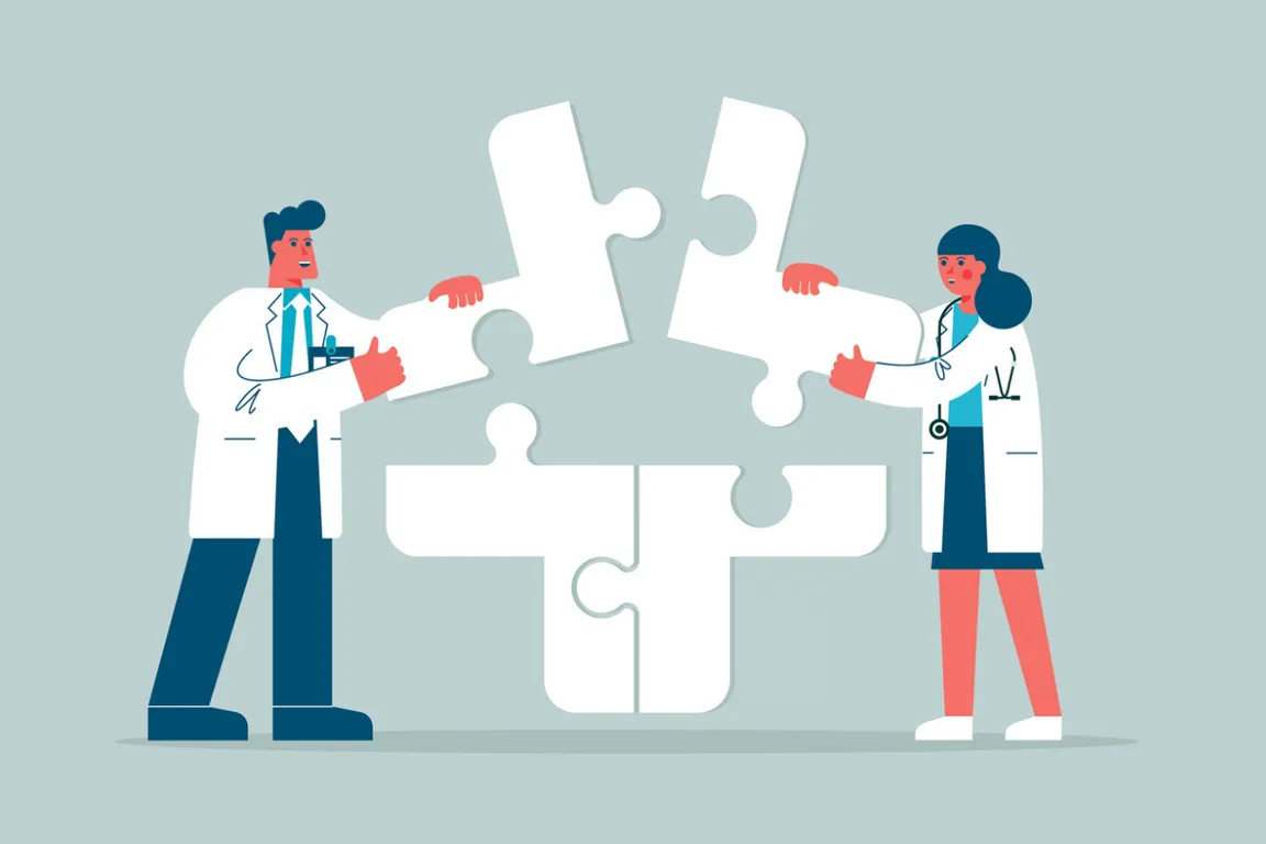 Two clinicians working together on a puzzle, symbolizing teamwork and collaboration
